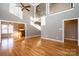 Two-story living room with hardwood floors, fireplace, and high ceilings at 1107 Fox Chase Dr, Newton, NC 28658