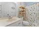 Clean bathroom with floral shower curtain and shelving unit at 1769 Old Nc 27 Hwy, Mount Holly, NC 28120