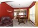 Dining room with dark wood table and chairs, and red walls at 2427 Normancrest Dr, Charlotte, NC 28270