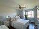 Bright bedroom with a queen bed, large window, and hardwood floors at 3700 Zebulon Williams Rd, Monroe, NC 28110