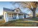 Charming craftsman home with a spacious front porch and mature trees at 400 N Ashe Ave, Newton, NC 28658