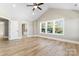 Large bedroom with hardwood floors and access to bathroom at 4444 Triumph Sw Dr, Concord, NC 28027