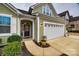 Inviting front entry and a two-car garage enhance this beautiful home's exterior at 5348 Baker Ln, Lake Wylie, SC 29710