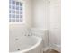 Bathroom with a large garden tub and block window at 570 Strathclyde Way, Rock Hill, SC 29730