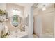 Clean bathroom with a shower/tub combo and updated vanity at 939 Autumnwood Ln, Charlotte, NC 28213