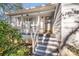 Charming front porch with steps leading to the entrance at 939 Autumnwood Ln, Charlotte, NC 28213