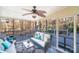 Bright sunroom with comfy seating and access to deck at 939 Autumnwood Ln, Charlotte, NC 28213