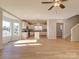 Open concept kitchen and living room with hardwood floors and an island at 9405 Tradewinds Ct, Lancaster, SC 29720