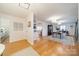 Spacious dining room with hardwood floors, elegant furnishings, and large windows at 107 Westwood Dr, Belmont, NC 28012