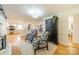 Living area with hardwood floors, armchairs, and a view into the kitchen at 107 Westwood Dr, Belmont, NC 28012