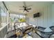 Cozy screened porch with wicker furniture and a TV at 107 Westwood Dr, Belmont, NC 28012