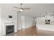 Living room with hardwood floors, fireplace, and built-in shelving at 11818 Red Leaf Dr, Charlotte, NC 28215