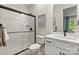 Clean bathroom with white subway tiles, a frameless shower, and modern vanity at 13312 Chopin Ridge Rd, Huntersville, NC 28078