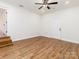 Bright basement room featuring hardwood floors and a door leading outside at 138 Pounds Sw Ave, Concord, NC 28025