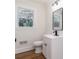 Clean bathroom with white vanity, toilet and hardwood floors at 138 Pounds Sw Ave, Concord, NC 28025