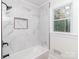 Modern bathroom with marble tile shower and a window at 138 Pounds Sw Ave, Concord, NC 28025