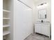 Bathroom featuring a white vanity, marble countertop and built-in shelving at 138 Pounds Sw Ave, Concord, NC 28025