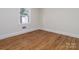 Bright bedroom featuring hardwood floors and neutral walls at 138 Pounds Sw Ave, Concord, NC 28025