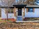 Charming white house with a black door and wood accents at 138 Pounds Sw Ave, Concord, NC 28025
