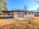 Rear view of house with carport and paved patio at 138 Pounds Sw Ave, Concord, NC 28025