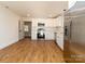 Modern kitchen with white cabinets and stainless steel appliances at 138 Pounds Sw Ave, Concord, NC 28025