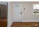 White kitchen with stainless steel appliances and hardwood floors at 138 Pounds Sw Ave, Concord, NC 28025
