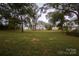 Large backyard with lush green grass and wooden fence at 1735 Herndon Farm Rd, Rock Hill, SC 29732