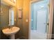 Simple bathroom with pedestal sink and light-colored walls at 1735 Herndon Farm Rd, Rock Hill, SC 29732
