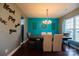 Teal-walled dining room with chandelier and hardwood floors at 1735 Herndon Farm Rd, Rock Hill, SC 29732