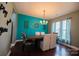 Teal-walled dining room with chandelier and hardwood floors at 1735 Herndon Farm Rd, Rock Hill, SC 29732
