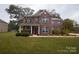 Brick two-story house with landscaping and a red door at 1735 Herndon Farm Rd, Rock Hill, SC 29732