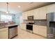 Modern kitchen with stainless steel appliances and light cabinets at 1735 Herndon Farm Rd, Rock Hill, SC 29732