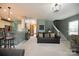 Living room with gray couch and view of kitchen and stairs at 1735 Herndon Farm Rd, Rock Hill, SC 29732