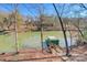 Lakefront property with a dock and a boathouse, with trees in the background at 179 L A Dr # 60, Taylorsville, NC 28681