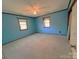 Bright bedroom with light blue walls and carpet at 36954 Tercher Rd, New London, NC 28127