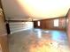 Spacious garage with concrete floor and wood paneling at 36954 Tercher Rd, New London, NC 28127