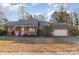 Brick ranch house with attached garage and front porch at 401 W Ballard St, Cherryville, NC 28021