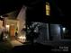 Night view of home's garage and entryway at 5661 Cambridge Bay Dr, Charlotte, NC 28269