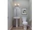Stylish bathroom with pedestal sink and toilet at 5684 Clear Creek Ln, Charlotte, NC 28215