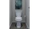 Clean bathroom with toilet and wood-look floor at 5684 Clear Creek Ln, Charlotte, NC 28215
