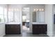 Double vanity bathroom with dark brown cabinets and a view into bedroom at 5684 Clear Creek Ln, Charlotte, NC 28215