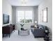 Gathering room with gray sofa and a modern coffee table at 5684 Clear Creek Ln, Charlotte, NC 28215