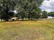 Expansive grassy lot with mature trees and a view of a nearby home at 6050 Mcconnells Hwy, McConnells, SC 29726