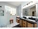 Elegant bathroom with a double vanity, walk-in shower, and modern fixtures at 6635 Old Magnolia Ln, Mint Hill, NC 28227