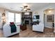 Open living room featuring a corner fireplace, hardwood floors, and ample natural light at 6635 Old Magnolia Ln, Mint Hill, NC 28227