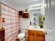 Bathroom with toilet, shower, and wood vanity at 7148 Abbotts Glen Dr, Charlotte, NC 28212