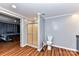 Bathroom with shower stall, toilet, and wood-look flooring at 8327 Walkup Rd, Waxhaw, NC 28173