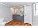 Bathroom with double vanity, oval mirrors, and updated flooring at 8327 Walkup Rd, Waxhaw, NC 28173