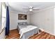 Bedroom with double bed, ceiling fan and wood-look floors at 8327 Walkup Rd, Waxhaw, NC 28173