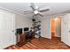 Bedroom with wood-look floors, a desk, and a ceiling fan at 8327 Walkup Rd, Waxhaw, NC 28173